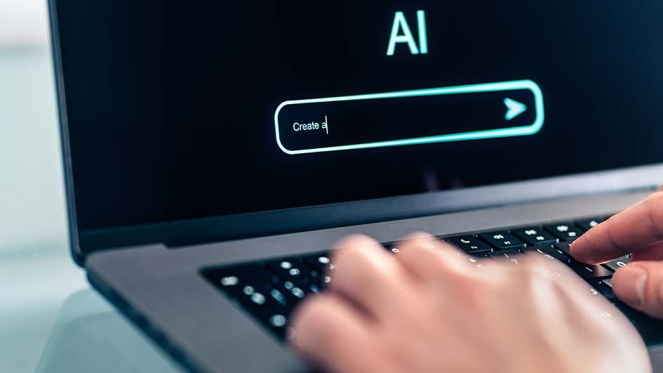 Een laptop met 'AI' op het scherm, een zoekbalk met 'Create a' en handen die op het toetsenbord typen.