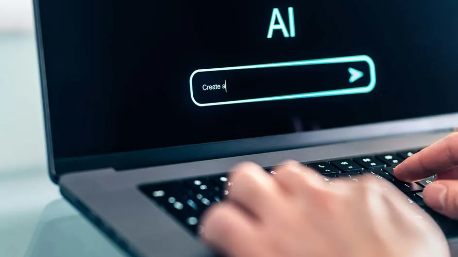 Een laptop met 'AI' op het scherm, een zoekbalk met 'Create a' en handen die op het toetsenbord typen.