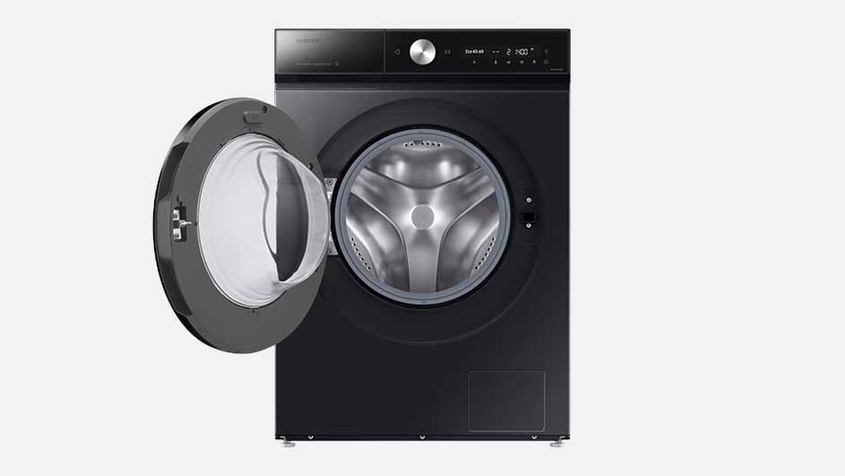 A black Samsung washing machine with a large round door open and a digital display is shown on a plain background, ready for washing clothes.