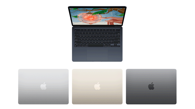 Een open laptop met een kleurrijk scherm en een toetsenbord, met daaronder drie gesloten laptops in zilver, goud en grijs.