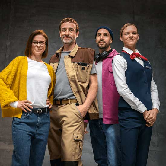 Four people in varied workwear stand confidently together, from casual clothes to formal uniform, representing several modern professions.