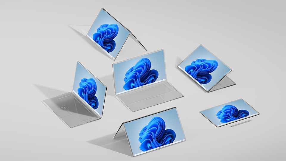 Multiple Windows laptops stacked around