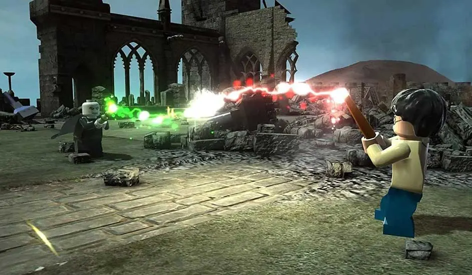 This is a video game. Two LEGO wizards duel with spells among ruins, their magic clashing brightly in the centre of the battlefield.
