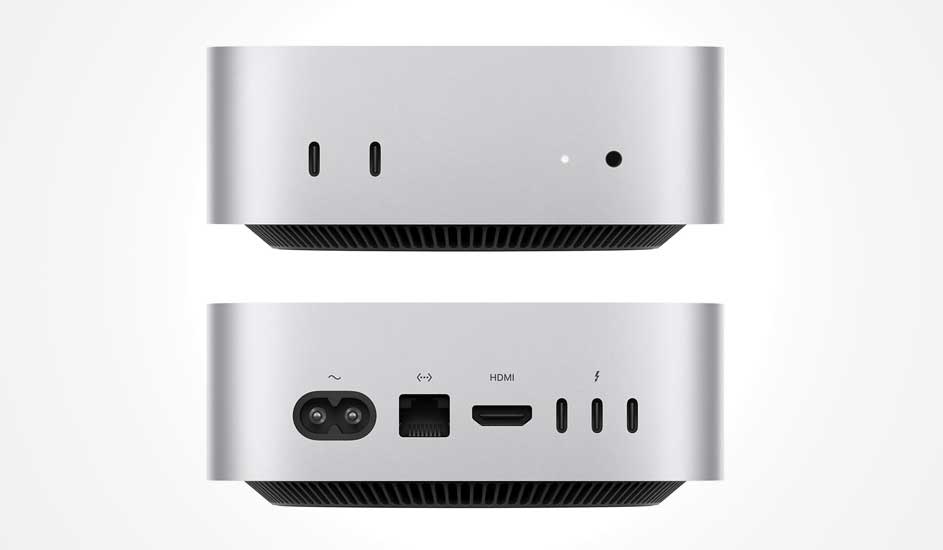 Een compacte zilverkleurige desktop met afgeronde hoeken, voorzien van meerdere aansluitingen aan voor- en achterkant. Het merk is Apple.