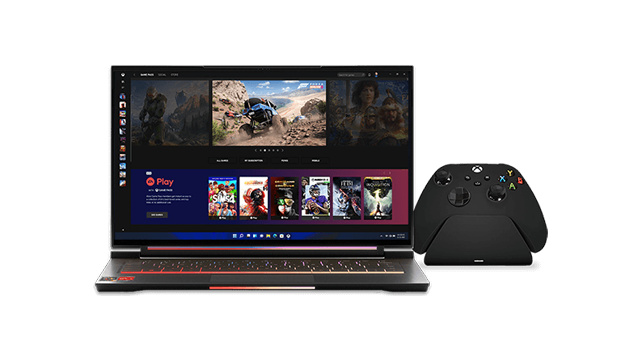 Een zwarte laptop met een scherm met games, naast een zwarte Xbox-controller.