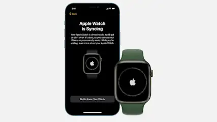 A smartphone displays "Apple Watch is Syncing" next to a watch with a green band.