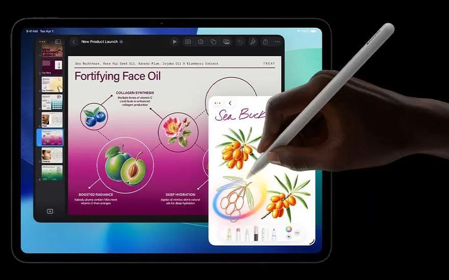 Hand uses a stylus to draw orange berries on the tablet while a bright presentation about face oil and skincare fills the main display.