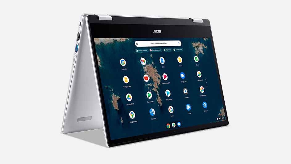 Een zilverkleurige laptop staat open, het scherm toont een startpagina met app-pictogrammen tegen een donkerblauwe wereldkaart achtergrond.