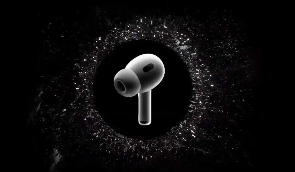 Een witte draadloze oordop staat centraal, omringd door een halo van witte spikkels tegen een zwarte achtergrond.