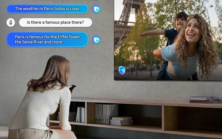 A woman uses her voice assistant on a smart TV, asking about Paris weather and landmarks, interacting with on-screen chat.