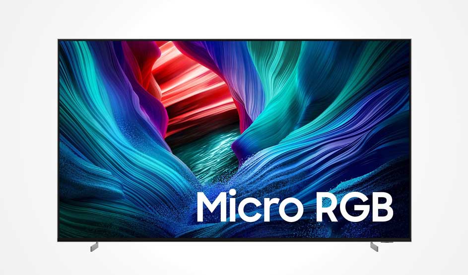 A TV displays a vivid Micro RGB image with flowing blue forms, a red light trail and shimmering depth at the bright centre.