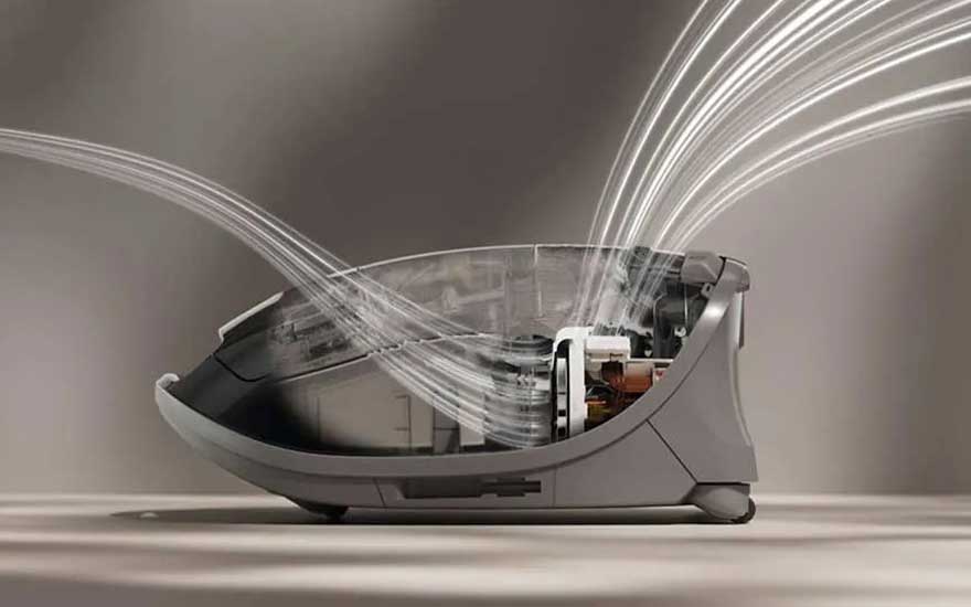 Een doorsnede van een stofzuiger toont luchtstroom en filtratie, wat een innovatief ontwerp illustreert voor optimale prestaties