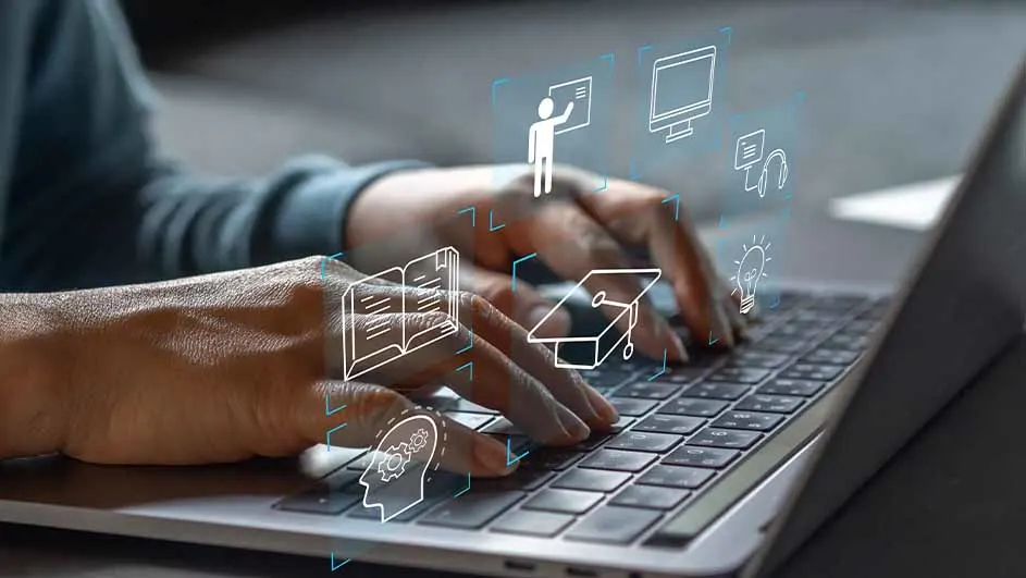 Iemand typt op een laptop met digitale iconen van leren, zoals een boek en een afstudeerhoed.