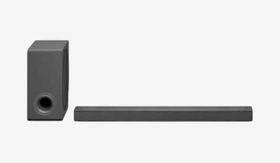 A black soundbar with a separate subwoofer sits on a white background, showing a sleek, modern and minimalist design.
