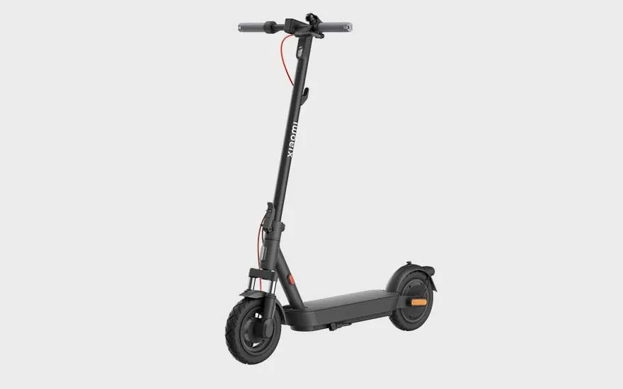 A sleek matte black Xiaomi electric scooter with red accents and robust tyres, ready for daily city use and easy transport.