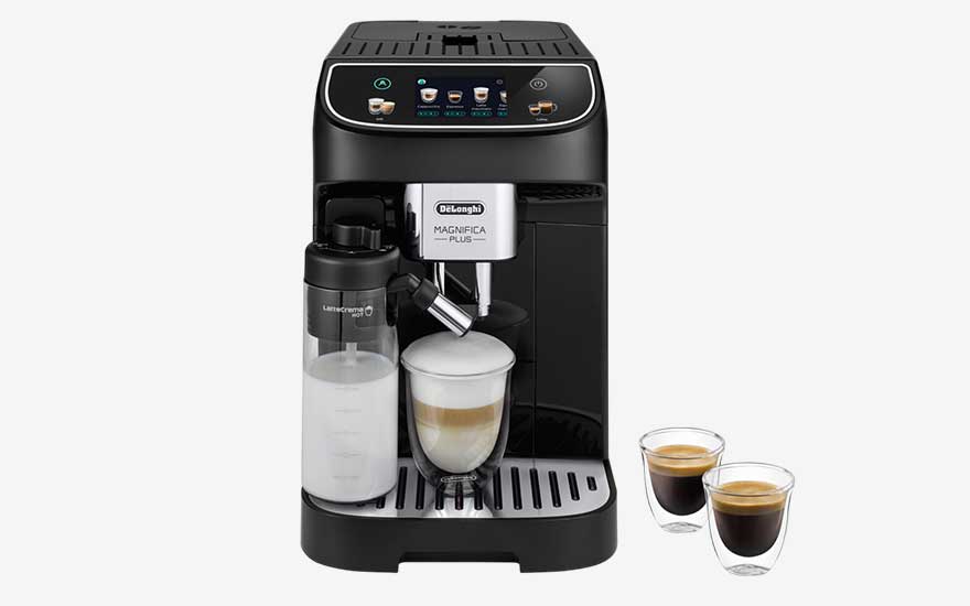 Black DeLonghi Magnifica Plus coffee machine with digital display, milk container, a cappuccino in a glass and two espressos alongside it.