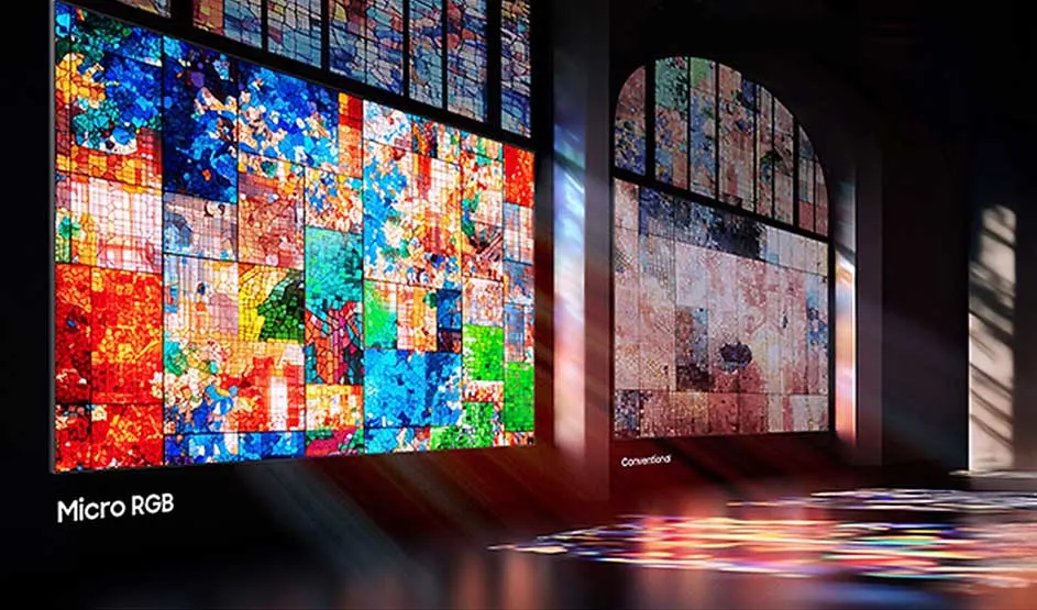 A futuristic display room showcases two large screens featuring vibrant Micro RGB technology. On the left, a colourful mosaic pattern in red, blue, yellow and green. Modern technology demonstration space.