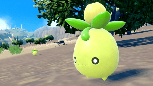 Een gele, peervormige figuur met groene bladeren staat op een heuvel, met bergen en een blauwe lucht op de achtergrond.