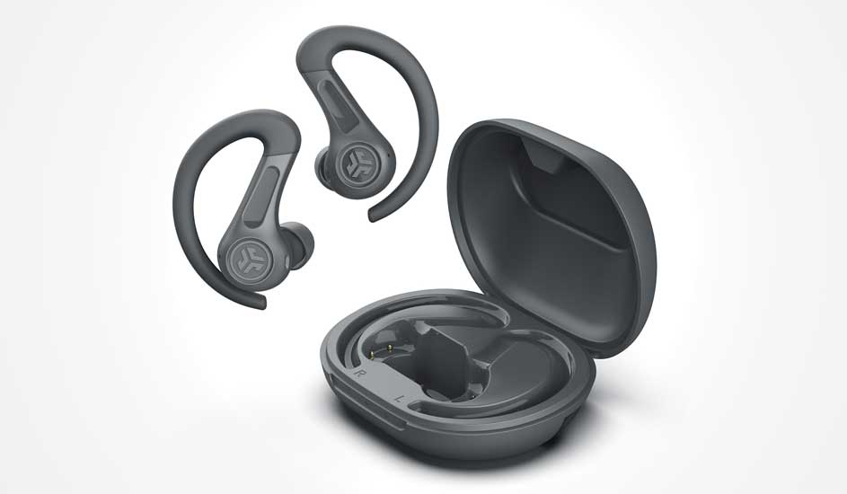 Dark grey sport earbuds with ear hooks float beside a round open charging case, made for a secure fit during energetic workouts.