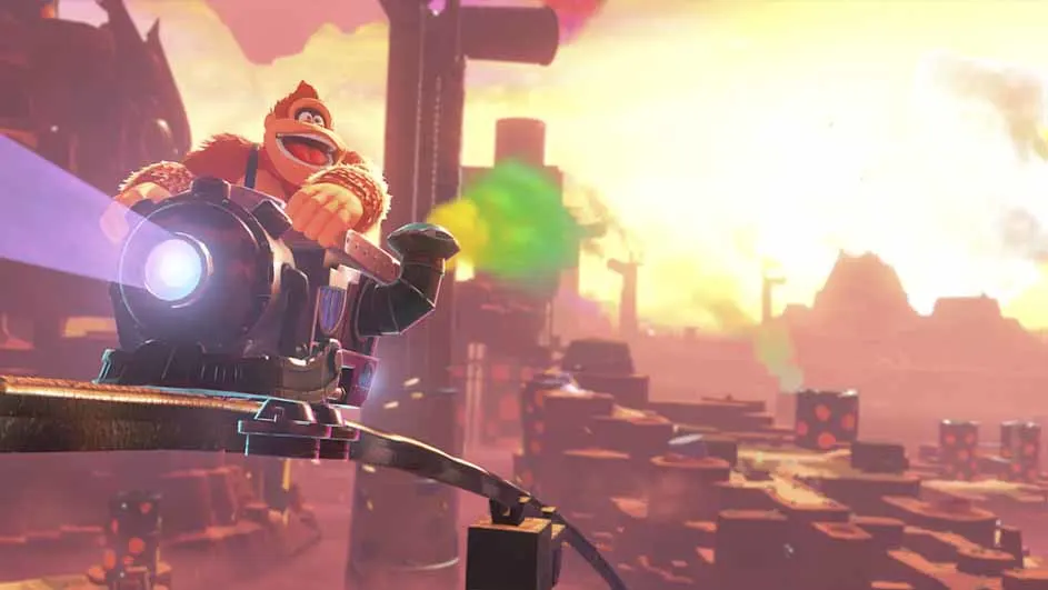 Een cartoon aap bestuurt een groot kanon tegen een roze en gele achtergrond met platforms en bergen.