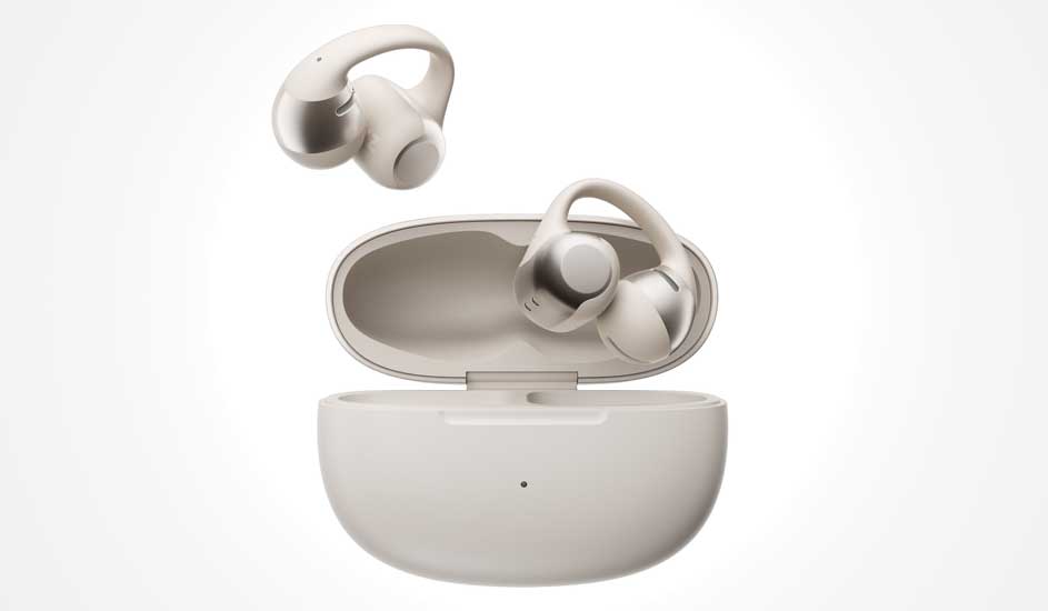 Cream true wireless earbuds with ear hooks, one resting inside an open charging case while the other hovers delicately above it.