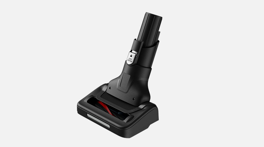 Zwarte stofzuiger voetstuk met rode borstelrol, staand tegen een witte achtergrond.