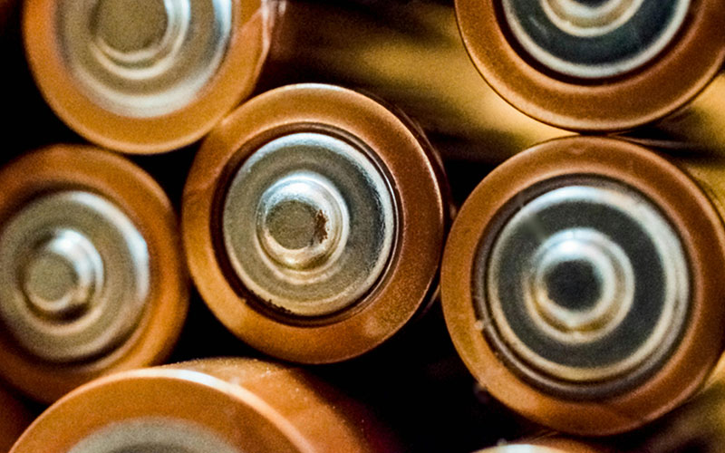 Close-up of stacked batteries.