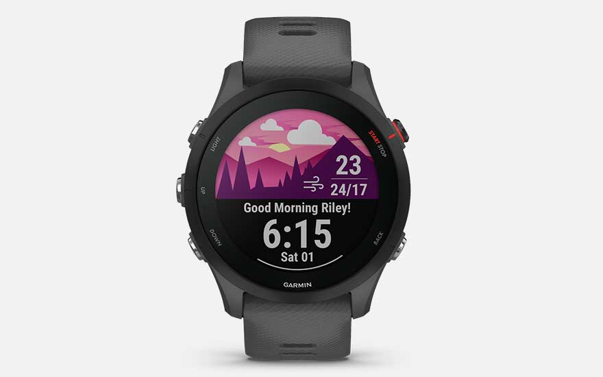 Garmin Forerunner sports watch with colourful screen shows time, date and morning greeting, plus weather and fitness info.