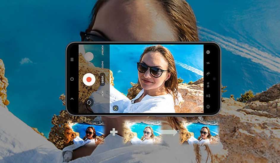 Een Samsung-smartphone legt een selfie vast van een persoon in witte kleding op een zonnige, rotsachtige locatie met blauwe lucht.