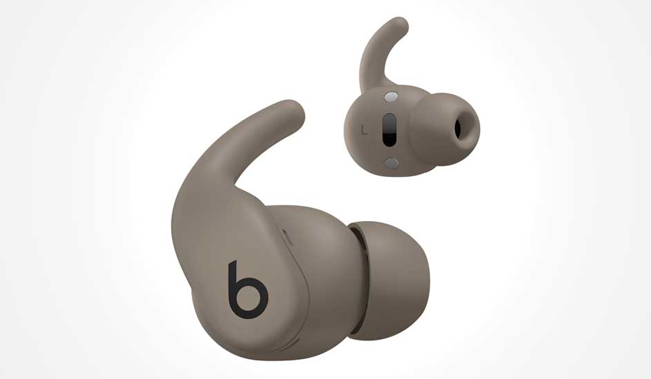 Two sand-coloured in-ear earbuds with stabilising fins and soft silicone tips, compact design focused on secure, comfortable fit.