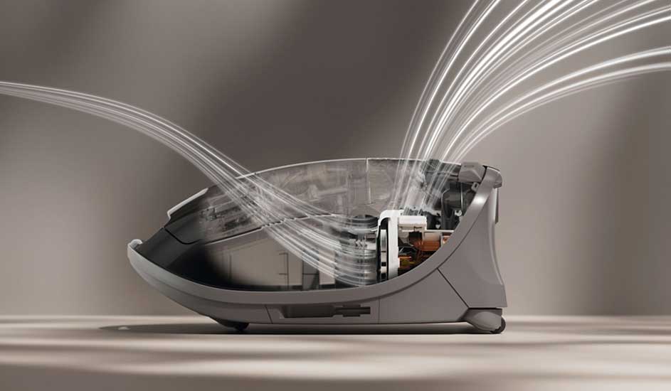 Een Dyson stofzuiger wordt in doorsnede getoond, met luchtstromen die door het apparaat bewegen.