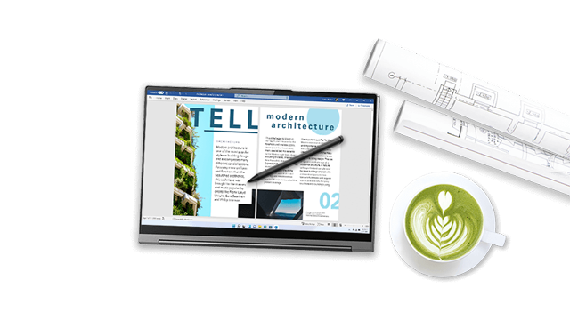 Een laptop met een architectuurmagazine en een pen, naast blauwdrukken en een kop matcha latte.