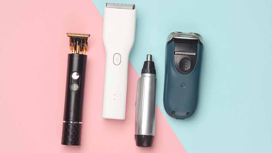 The image displays four grooming tools on a split pink and blue background. There is a black trimmer, a white clipper, a silver nose trimmer, and a blue electric shaver.