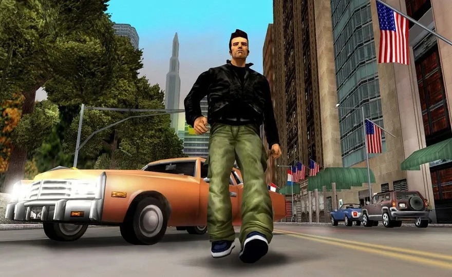 Man in a leather jacket strides confidently down a busy city street, cars and waving US flags lining the road.