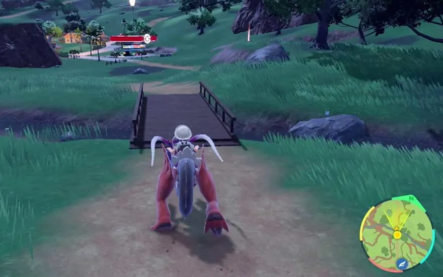 A mounted trainer rides a futuristic Pokémon across a wooden bridge towards a village and Pokémon Centre, guided by a colourful minimap bottom right.
