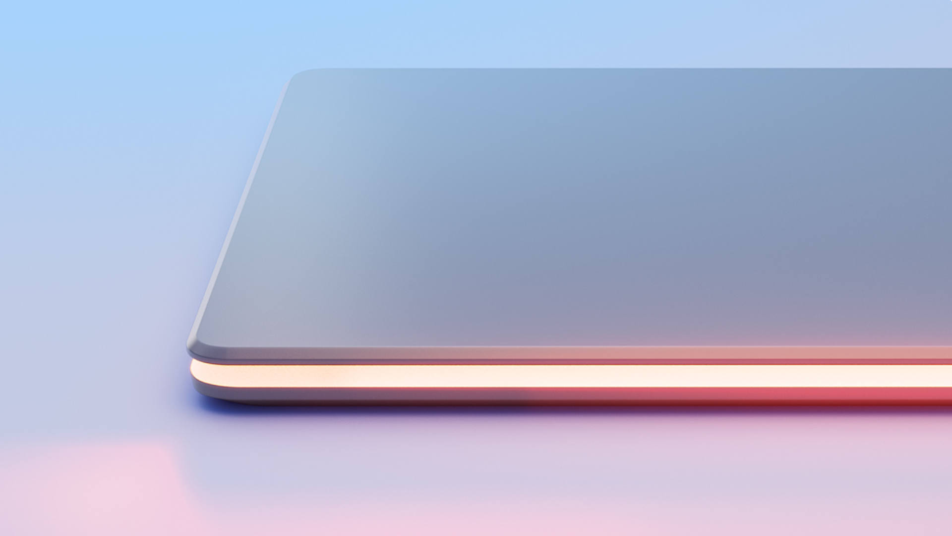 Een rechthoekig object met afgeronde hoeken ligt op een oppervlak met een blauwe en roze achtergrond.