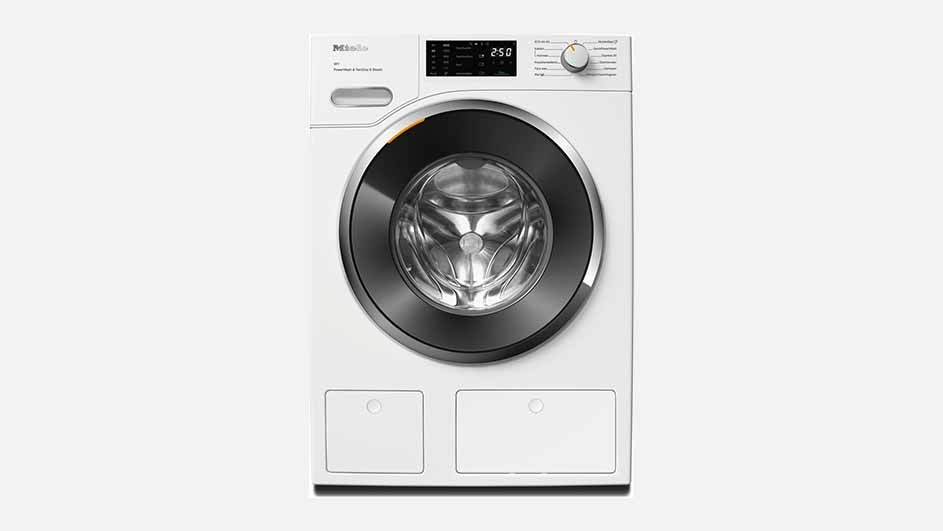 A white Miele washing machine with a large black door, digital display, and control knob is shown on a plain background, ready for washing.