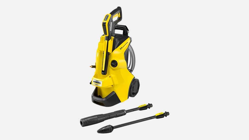 A yellow Kärcher pressure washer with wheels and two black nozzles is displayed on a plain background, ready for outdoor cleaning.