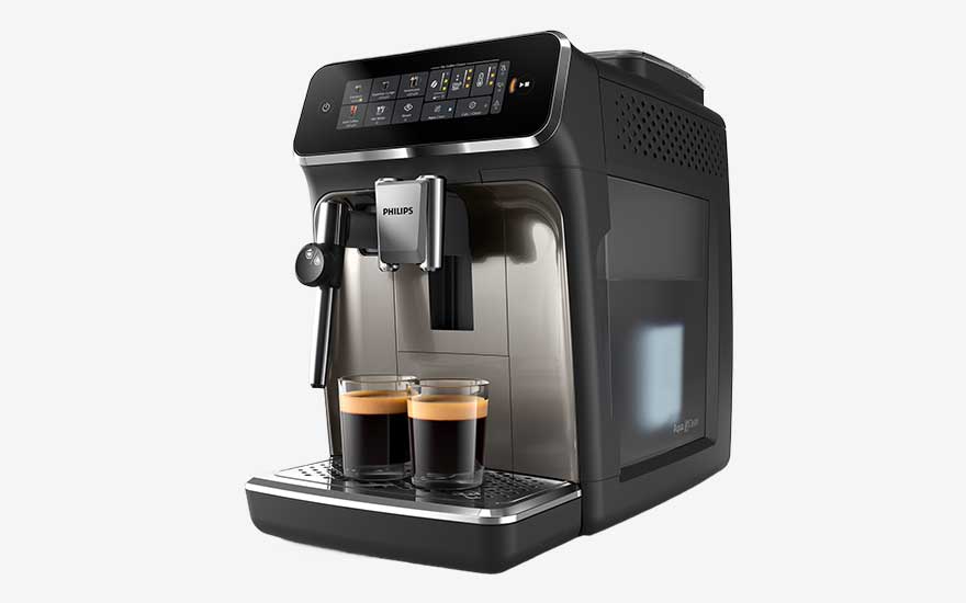 Black Philips espresso machine with a digital display and two glass cups of espresso with crema on the drip tray.