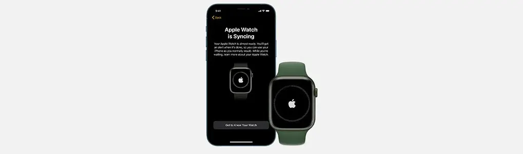 A phone displays "Apple Watch is Syncing" next to an Apple Watch with an Apple logo on its screen.
