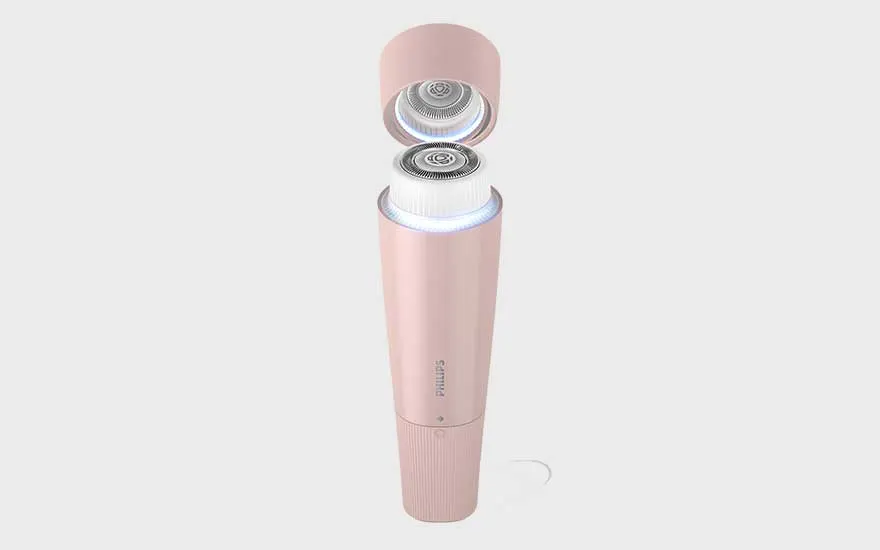 A stylish pink Philips facial cleansing brush with its cap open is displayed against a plain background.