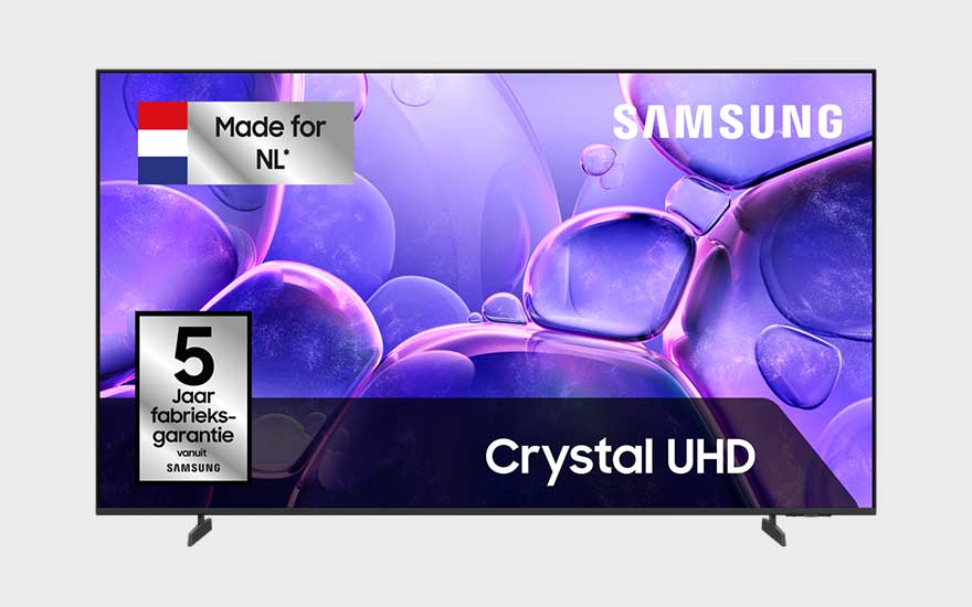 Samsung Crystal UHD TV with five-year warranty and “Made for NL” label, displaying purple bubble art on a modern flat screen.