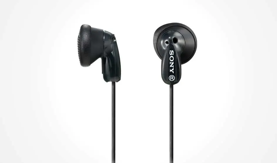 Black Sony earbuds with classic flat design, simple plastic housing and slim cable, shown upright against a bright white background.