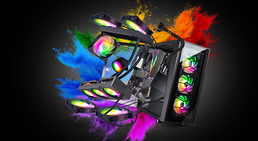 Ein Computergehäuse mit Lüftern in Regenbogenfarben vor einem Hintergrund mit Farbpulver.