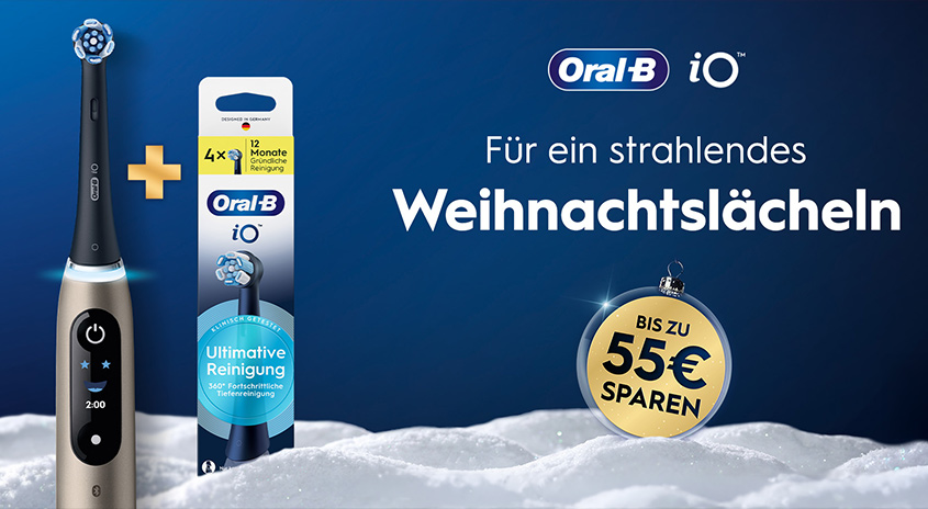 Oral-B iO Zahnbürste mit Aufsteckbürsten vor winterlichem Hintergrund, Weihnachtslächeln und bis zu 55 € Ersparnis.