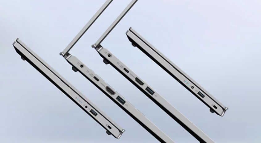 Mehrere Laptops sind teilweise geöffnet. Anschlüsse wie USB und HDMI sind an den Seiten sichtbar. Der Hintergrund ist hell.