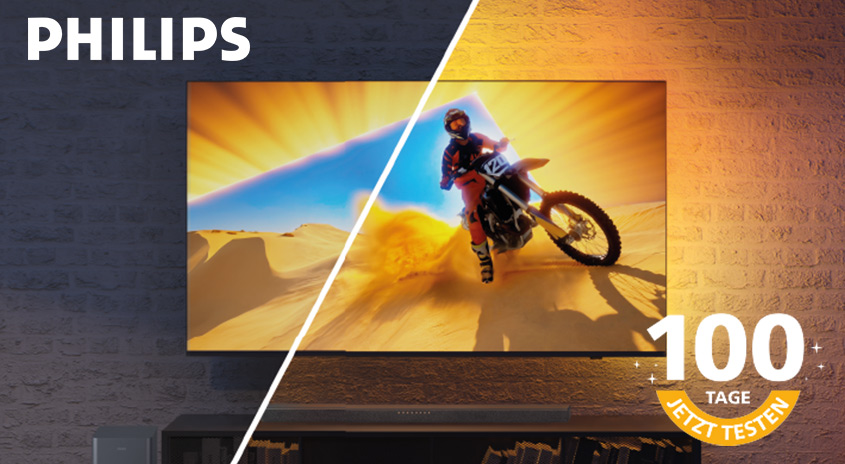 Ein Philips-Fernseher zeigt ein Motorrad in der Wüste. Rechts daneben steht "100 Tage jetzt testen".
