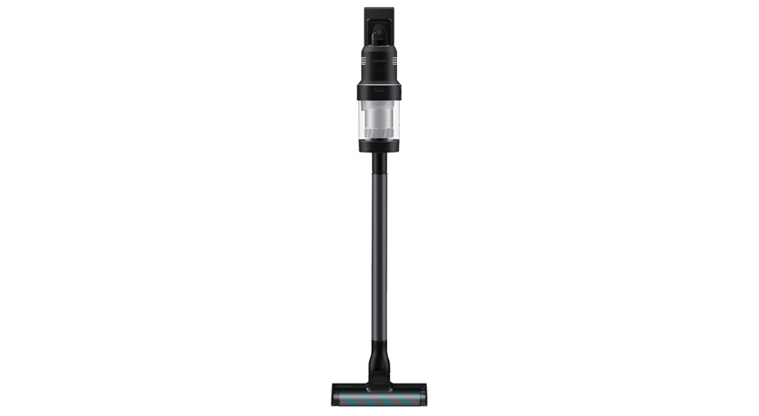 Ein kabelloser, grauer Staubsauger steht auf einem weißen Untergrund.