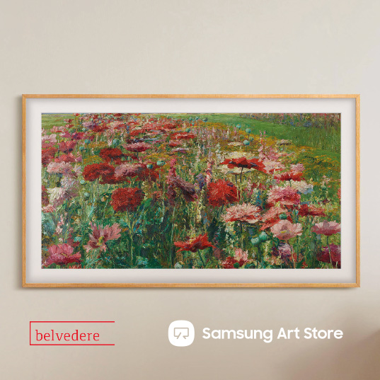 The Frame mit Blumen Desktop auf einer braunen Wand hängend