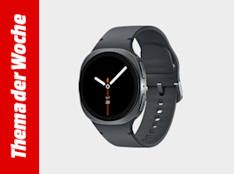 Dunkelgraue Smartwatch mit rundem, schwarzem Display und Silikonarmband; links vertikaler roter Balken „Thema der Woche“.
